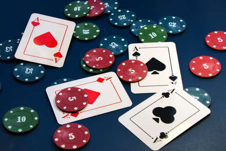 Four aces and chips, card game, cards on the table. Poker and blackjack, play cards.