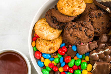 Chocolate candy on the white background, colorful candy texture, close-up and macro