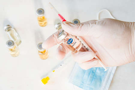 Tbilisi, Georgia - December 02, 2020: Pfizer's Corona virus and Covid - 19 new vaccine in ampules, vaccine of company Pfizer.のeditorial素材