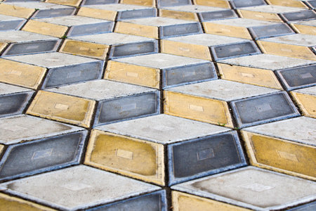 Geometry cubes optical illusion floor in the park of Tbilisi. Geometry figure background. Yellow and black.の写真素材
