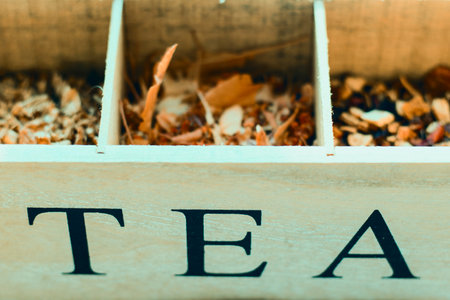 Herbal tea in the wooden box, dry flowers and plants, close-upの写真素材