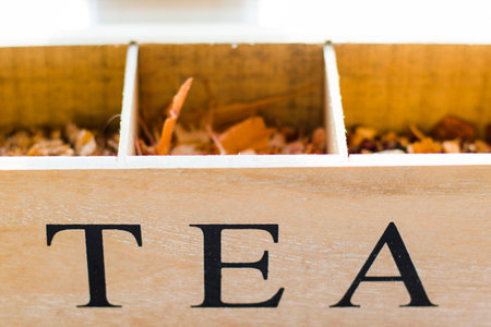 Herbal tea in the wooden box, dry flowers and plants, close-upの写真素材
