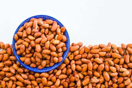 Peanuts on the white background, walnut snack, high angle view
