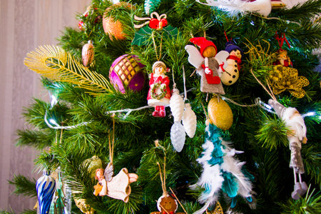Christmas tree, toys, lights and garlands, close-up