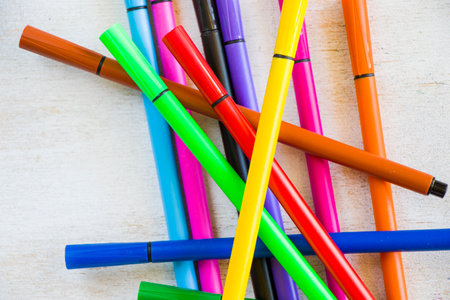 Large group of colorful drawing markers for sketching on the white background