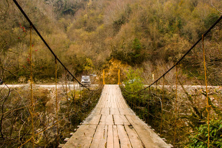 Wooden bridge, winter nature and big bridge in Georgiaの写真素材