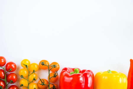 All color bell pepper, green spacy pepper and cherry tomatoes, colorful vegetables background, raw ingredientsの写真素材