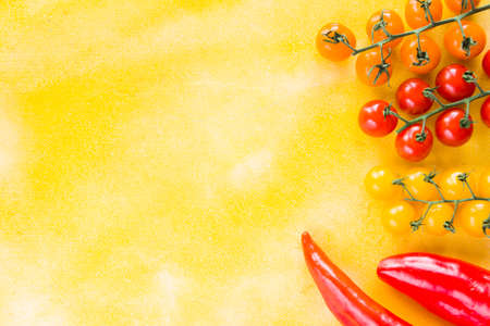 Red bell pepper, green spacy pepper and cherry tomatoes, colorful vegetables background, raw...