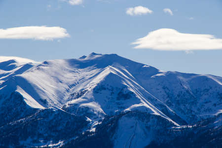 Snowy mountains landscape in Gudauri, Georgia. Sunny day.