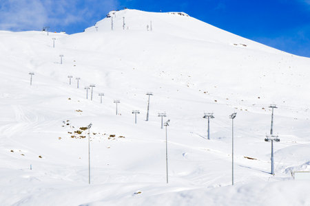 Georgian ski resort in Gudauri. Snowy mountains, daytime and sunlight.の写真素材