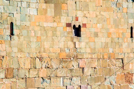 Old stone wall background and texture, church facade