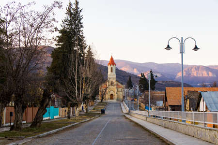 Church in Asureti, Georgia. Old famous church facade and street. Stone road.の写真素材
