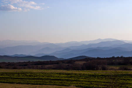 Mountain range landscape during sunset, view of mountain and hill lines, horizon in Georgia