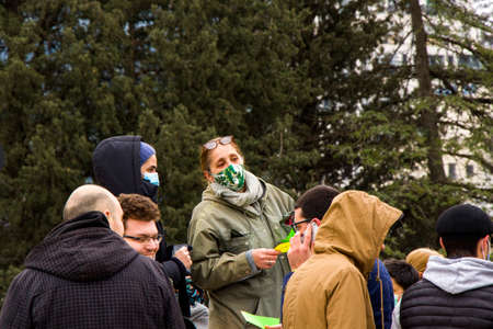 Tbilisi, Georgia - February 20, 2021: Georgian protests in front of Vakis park. People with medical face masks.のeditorial素材