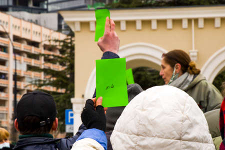 Tbilisi, Georgia - February 20, 2021: Georgian protests in front of Vakis park. People with medical face masks.のeditorial素材