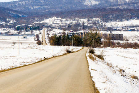Highway and road landscape and view, winter snow and sunlight in Georgiaの写真素材