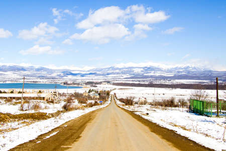 Highway and road landscape and view, winter snow and sunlight in Georgia