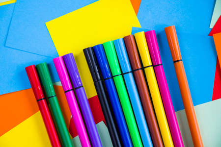 Sketch markers on the colorful paper background, paper board and empty space for text, cardboard