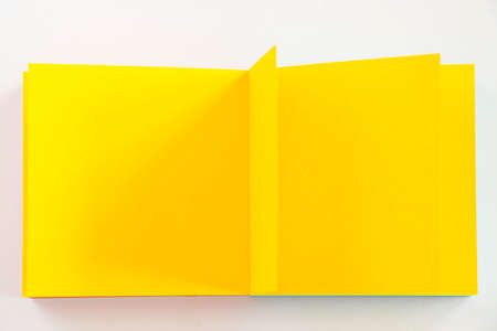 Yellow paper background, paper board and empty space for text