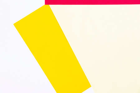 Colorful paper background, yellow and red paper board and geometric figures, pastel colored