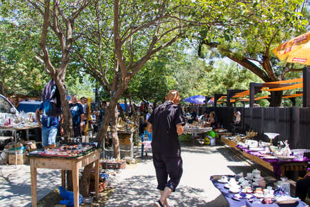 Tbilisi, Georgia - July 05, 2021: People in the open air marketplace in the park.
