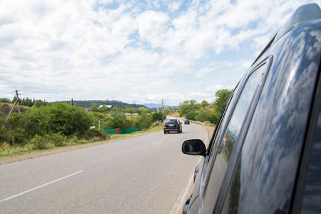 Car mirror and highway view, black carのeditorial素材