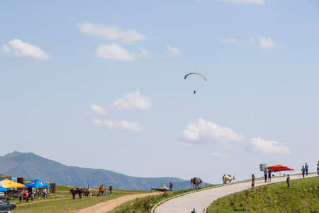 Khazbegi, Georgia - August 5, 2021: Para planer fly view, sky and clouds, adrenaline and sportのeditorial素材