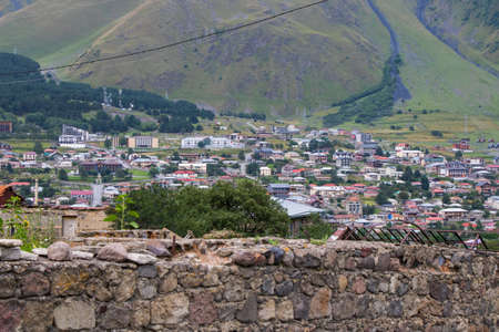 City view of Stepantsminda, Georgia. Old houses and mountain view.の写真素材