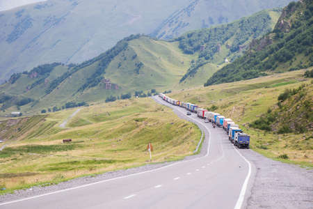 Khazbegi, Georgia - August 14, 2021: Large group of the trailers on the highway.のeditorial素材