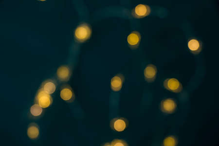 New year lights background, blurred lights, background for poster, blue and yellow colorsの写真素材