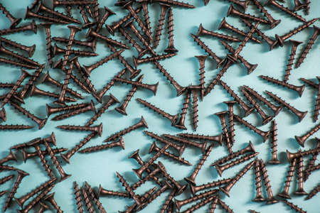 Black threaded screw on the green background, high angle viewの写真素材