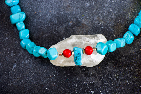 Colorful necklace and bracelet mix, beads and stone necklace, jewelry on the blue backgroundの写真素材