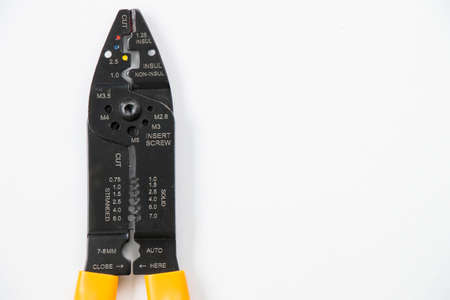 Wire stripper on the white background, high angle view