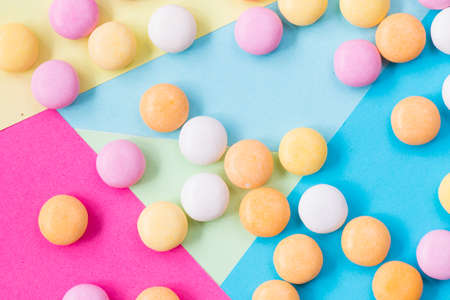 Candy on the colorful background, high angle view