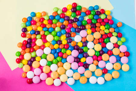 Candies on the colorful background, high angle view,の写真素材