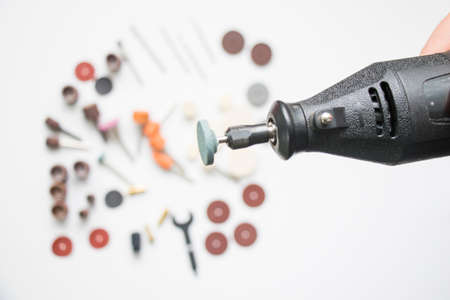 Dremel rotary kit, dremel heads, instrument for handwork on white backgroundの写真素材
