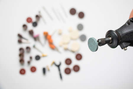 Dremel rotary kit, dremel heads, instrument for handwork on white backgroundの写真素材