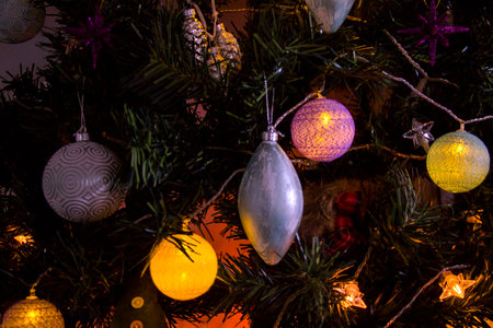 Christmas tree, toys, lights and garlands, close-up, 2023 year