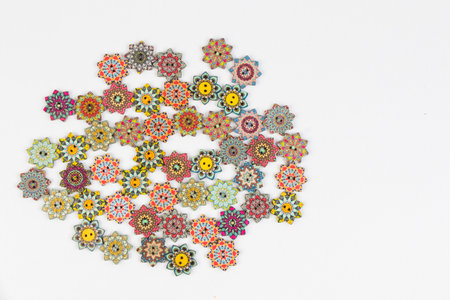 Colorful ornamental button on the white background, backdrop