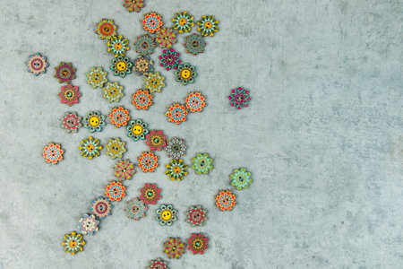 Colorful ornamental button on the gray background, backdropの写真素材