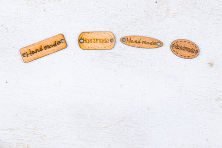 Handmade text on the wood, white backgroundの写真素材