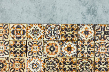 Colorful ornamental button on the gray background, backdropの写真素材