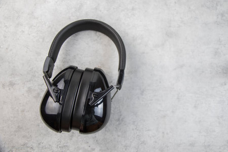 Earphones on the gray background, digital audio accessoryの写真素材