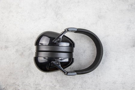 Earphones on the gray background, digital audio accessoryの写真素材