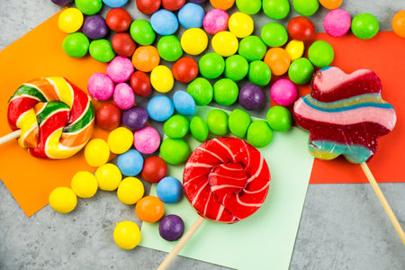 Skittles candy on the colorful table, colorful sweet candy backgroundの写真素材