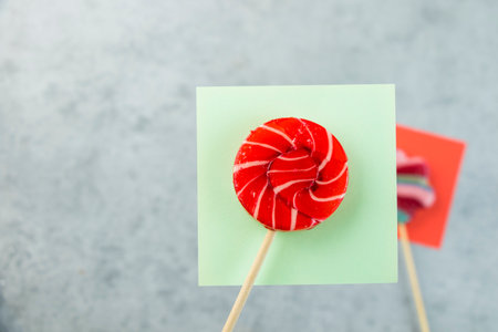 Colorful candies, lollypop on the color backgroundの写真素材