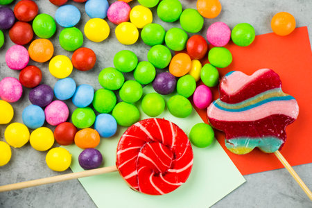 Skittles candy on the colorful table, colorful sweet candy backgroundの写真素材