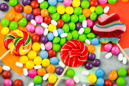 Skittles candy on the colorful table, colorful sweet candy backgroundの写真素材