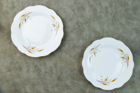 Empty tableware and dishware settings and serving on the gray background, plate, bowl and vintage spoonの写真素材