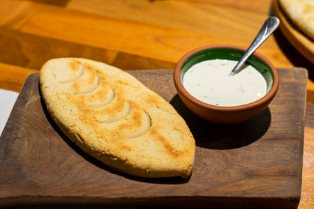 Mchadi, cornbread with souse on the wooden boardの写真素材
